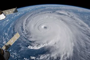 rapidly rotating storm system that forms in the tropics