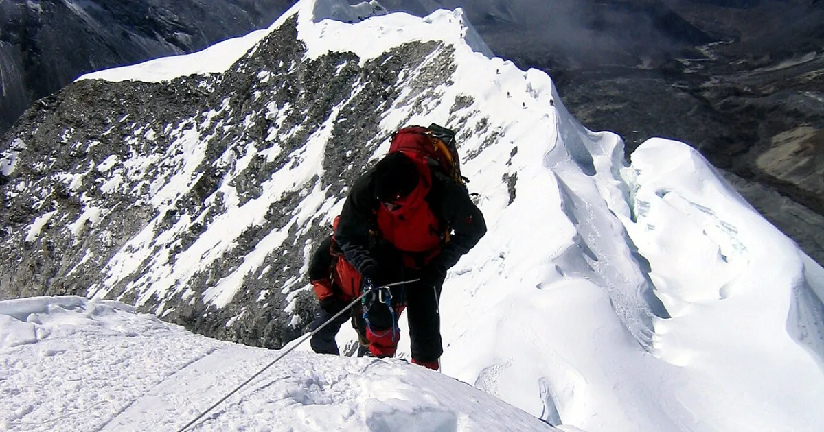 point on a surface that is higher in elevation than all points immediately adjacent to it, in topography